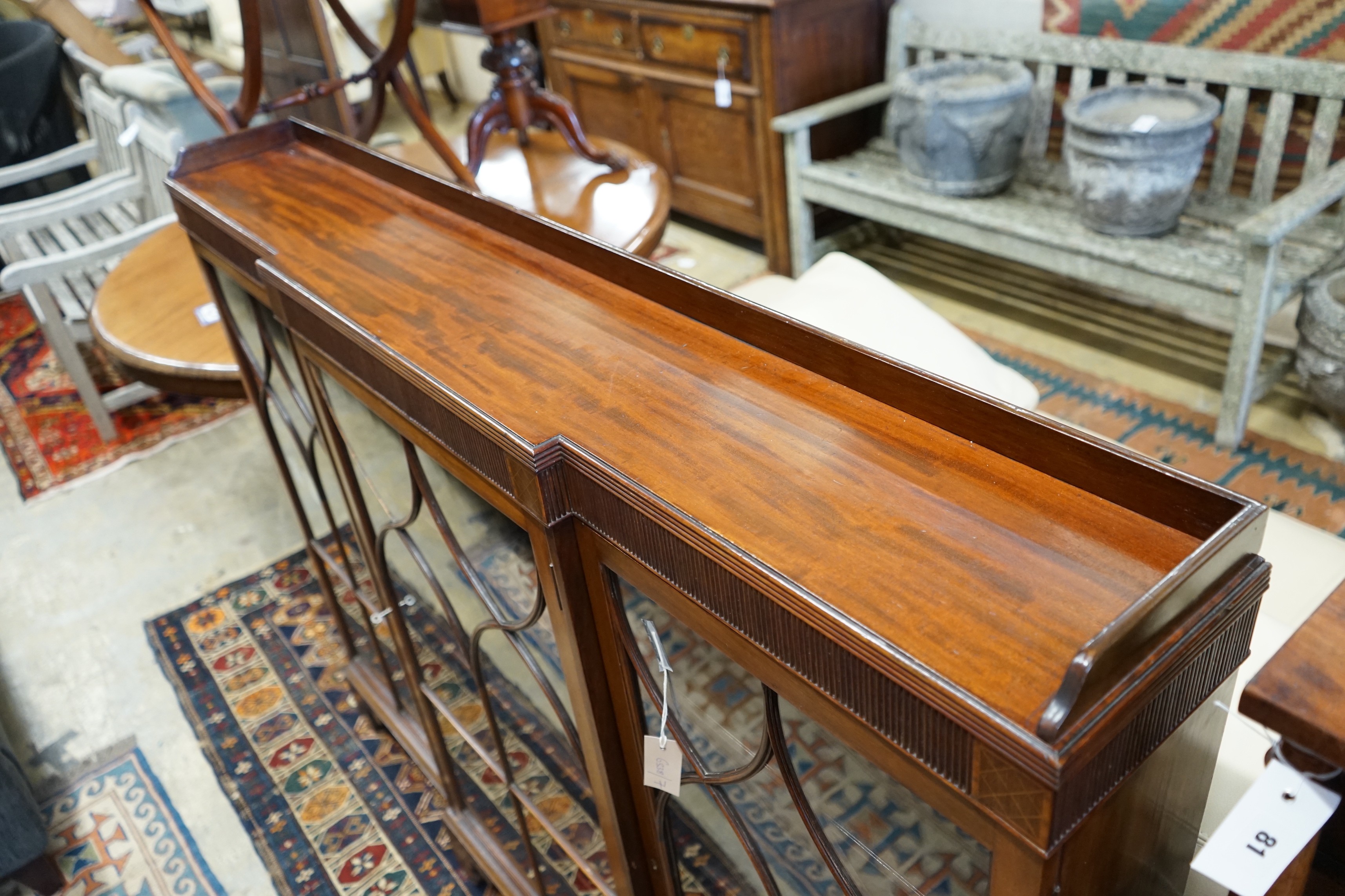 A 1920's Chippendale revival mahogany breakfront bookcase, length 154cm, depth 22cm, height 120cm